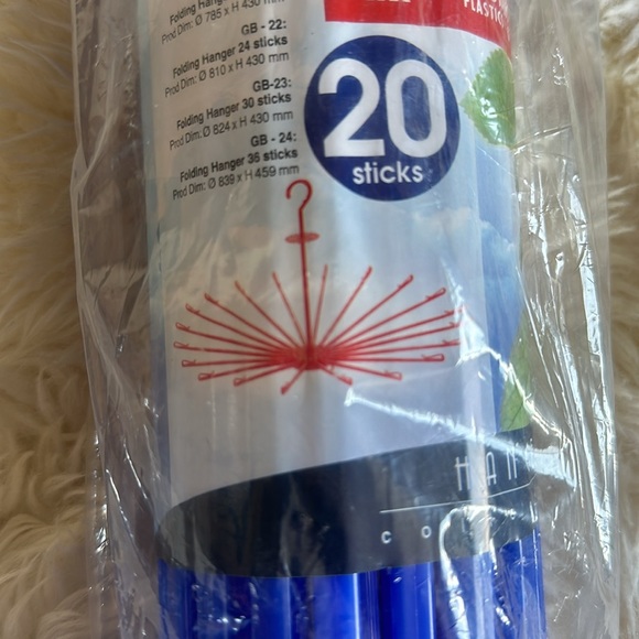 Bright blue hanging drying rack for clothes. Never opened. 17” long. Lightweight - Picture 2 of 7